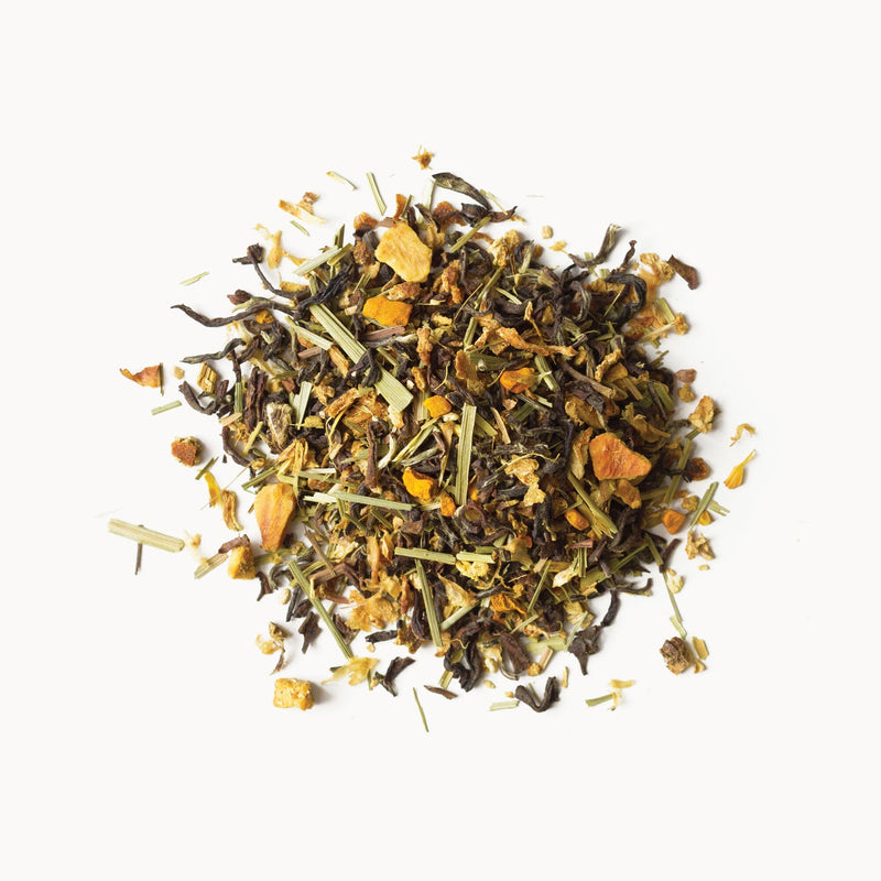 A pile of Lemon Ginger tea leaves on a white background by Rishi Tea & Botanicals.